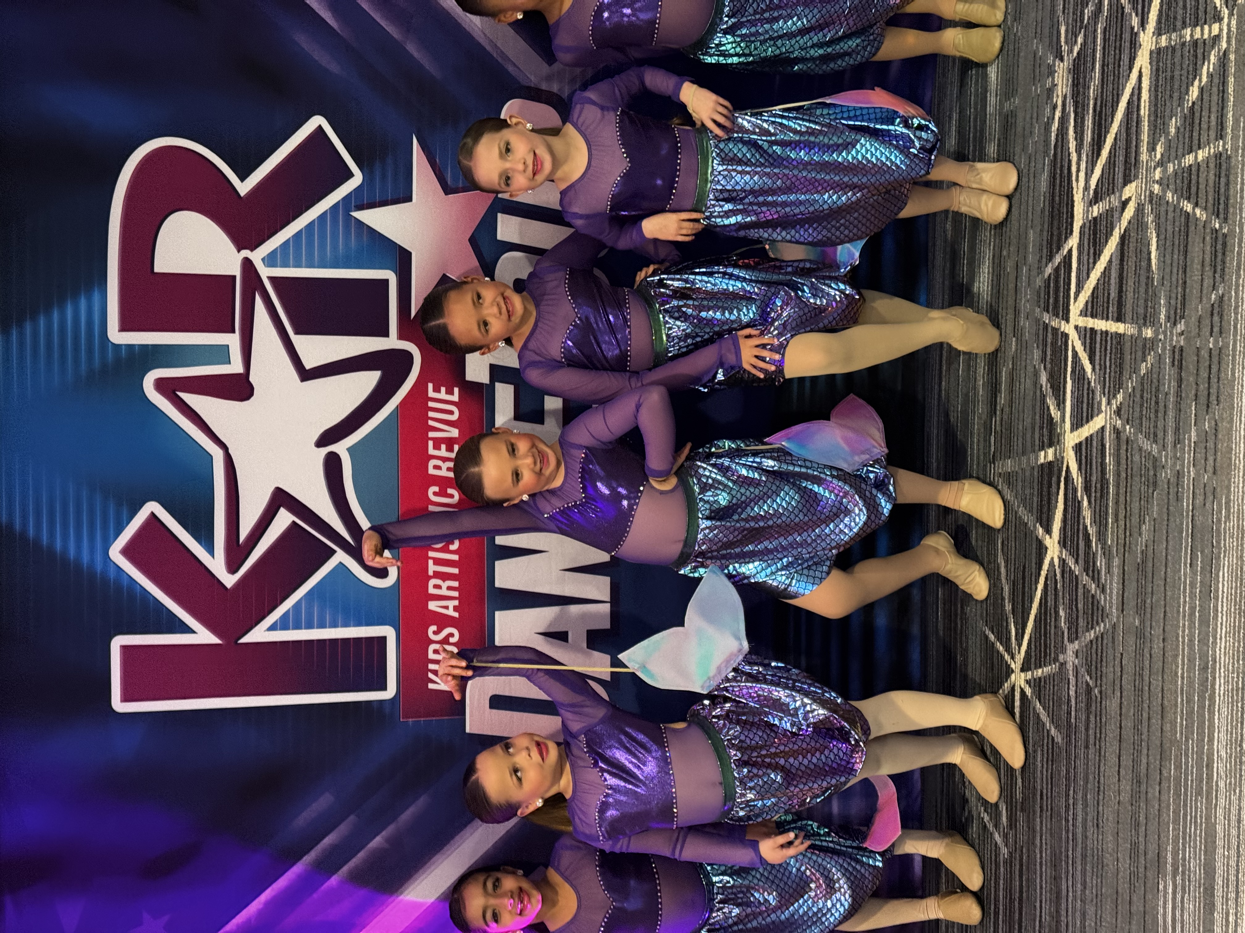 Lily with her dance team at a competition